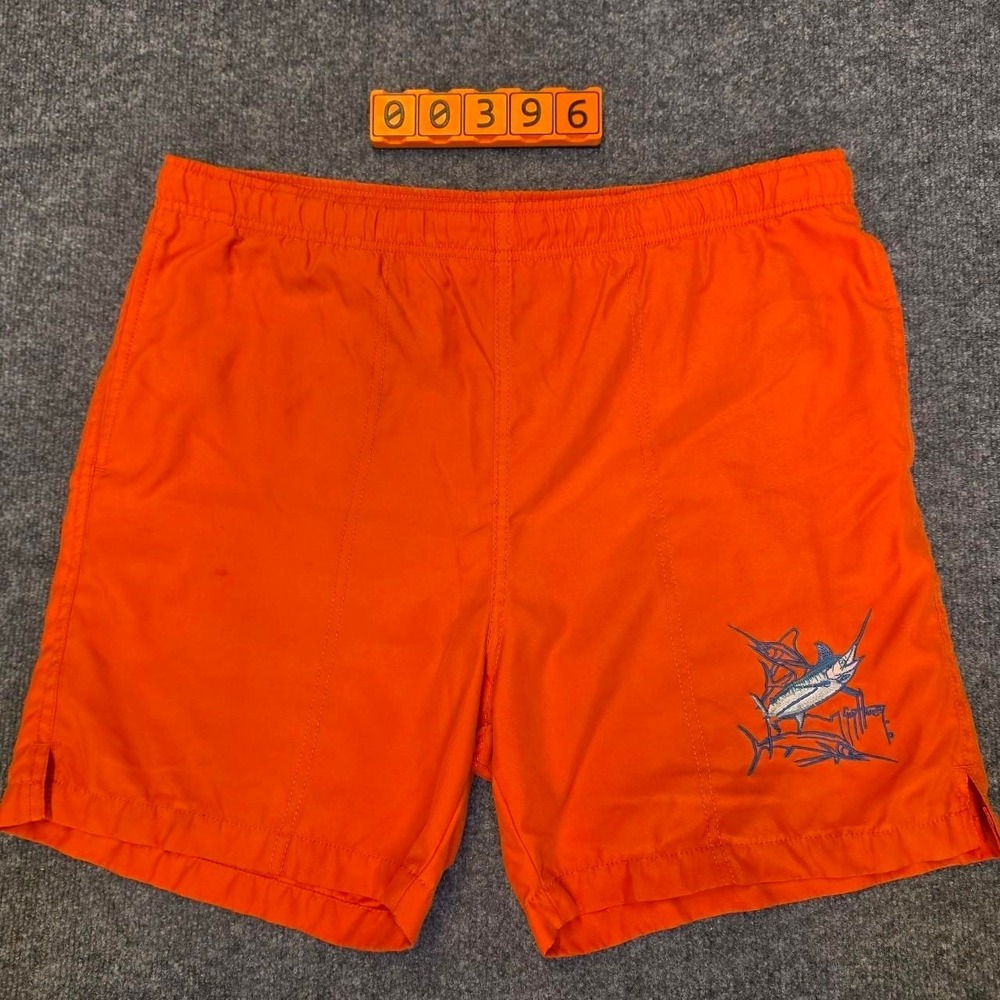 Guy Harvey orange swim shorts with blue marlin graphic, size M